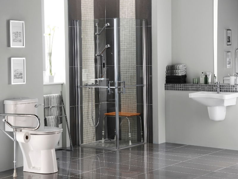 A bathroom with a chair inside the shower, providing enhanced accessibility for people with mobility impairments.