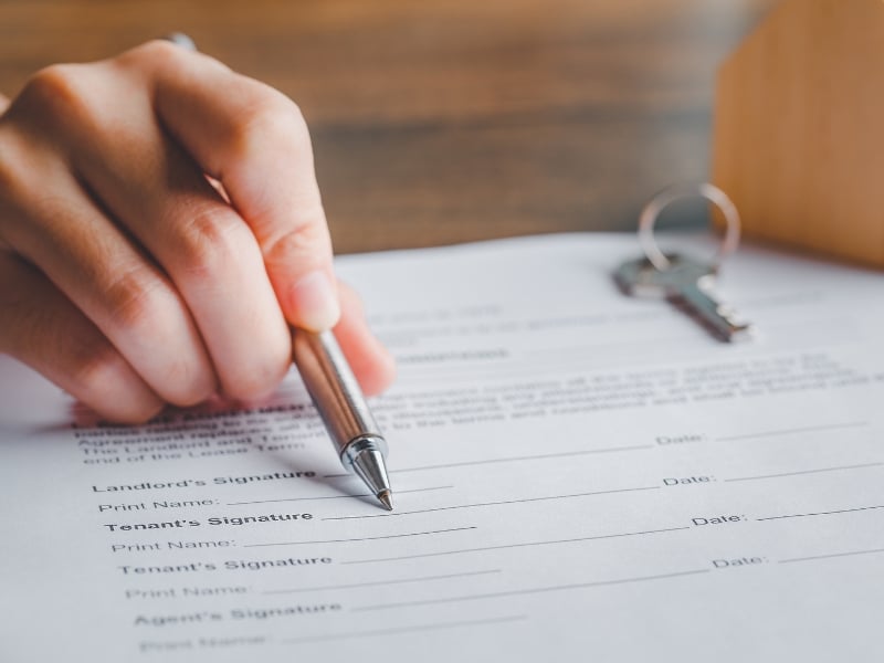 Signing documents required to apply for tenancy assistance under NDIS housing supports.